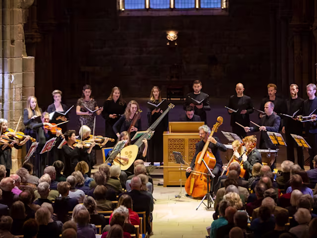 Dunster Festival Finale A period instrument ensemble, Spiritato, and choir performing to a packed audience in a moodily lit church