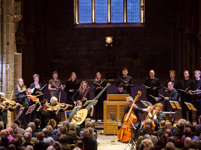 Dunster Festival Finale A period instrument ensemble, Spiritato, and choir performing to a packed audience in a moodily lit church
