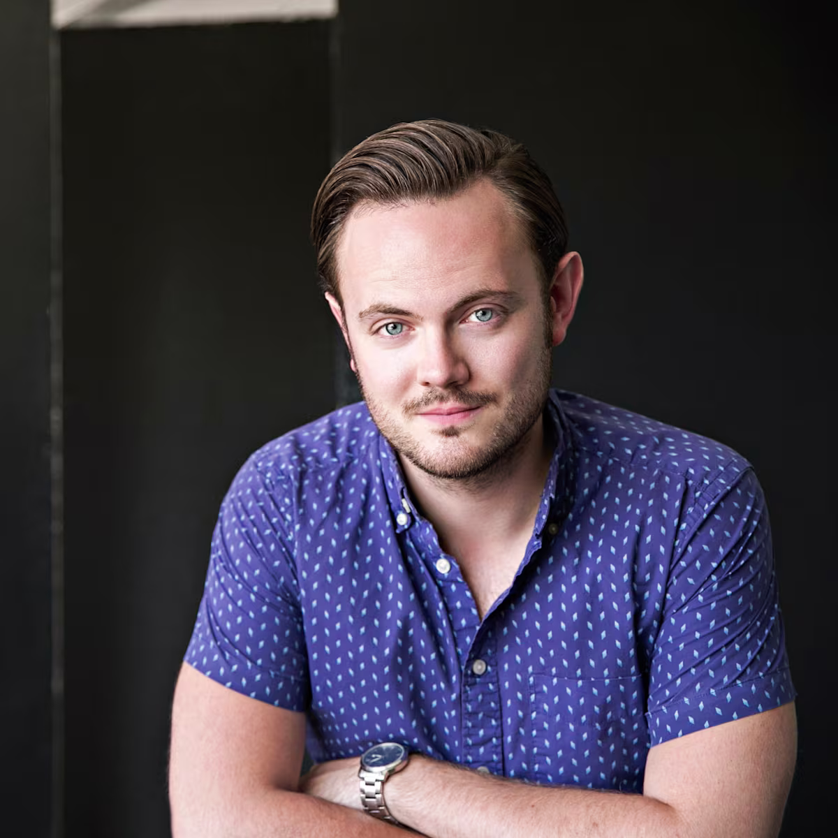 Nick Pritchard’s Summer Concert Picks nick pritchard tenor headshot in blue shirt by nick hames