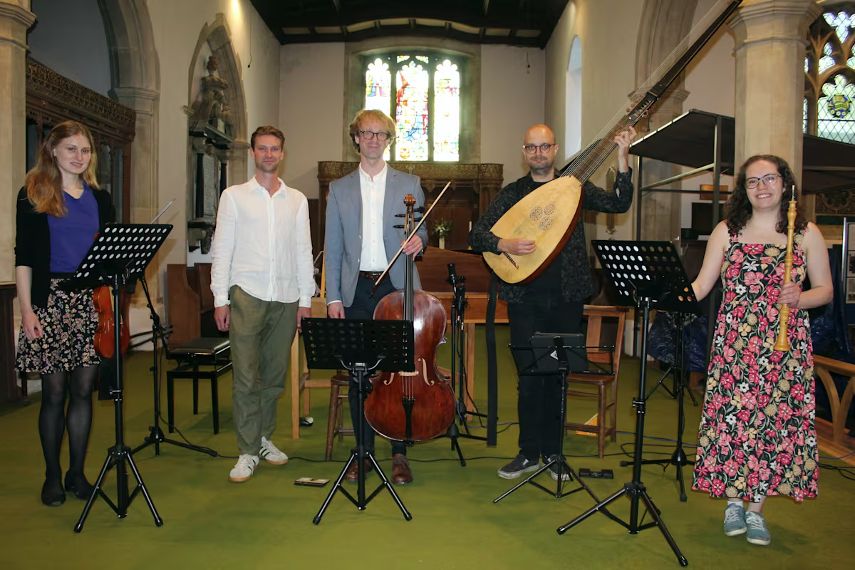 five members of obisidan baroque with historical instruments in a church