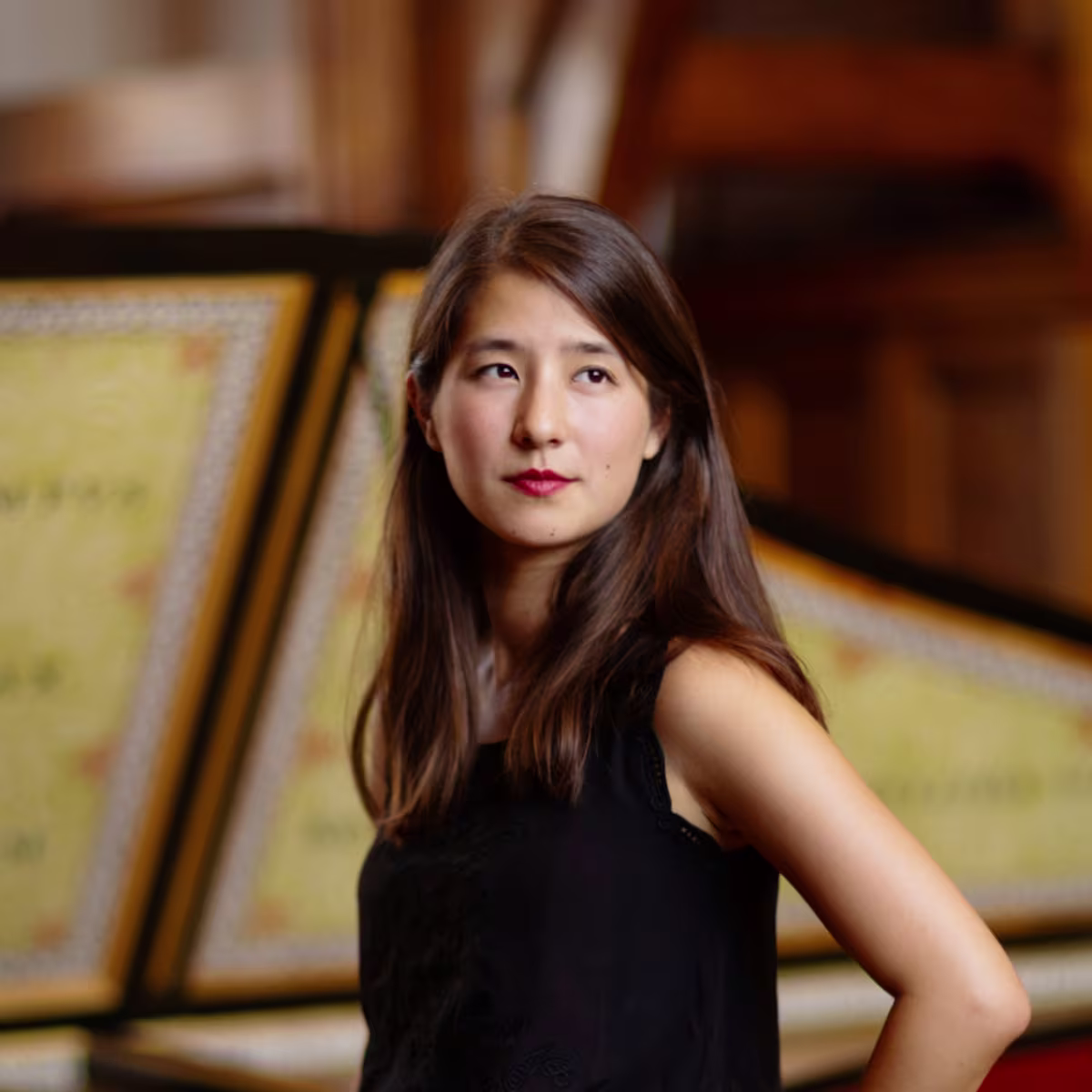 In Conversation: Apolline Khou apolline khou headshot with harpsichord in the background
