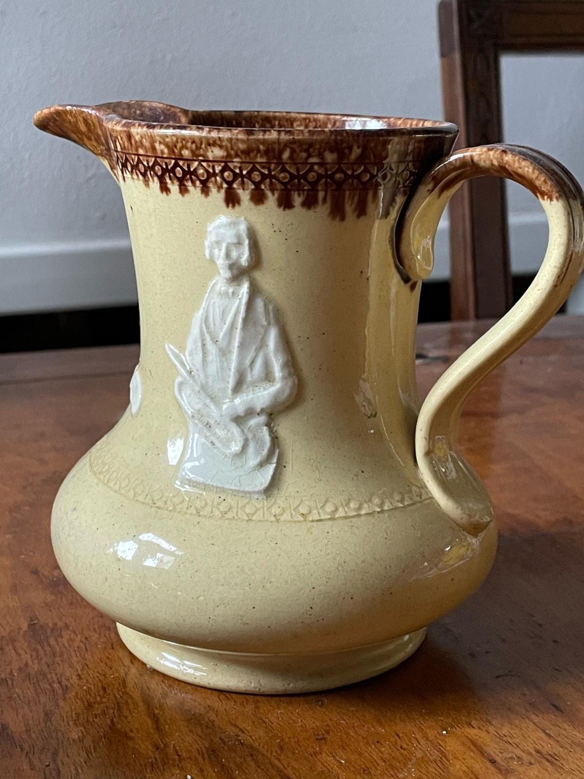 Original Distins "merch": 19th century jug depicting members of the Distin family and their instruments