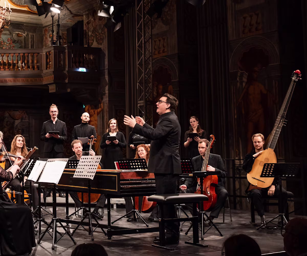 Handel's Lovers: A Recital of Operatic Arias & Duets baroque ensemble in a church with conductor waving his arms from the harpsichord