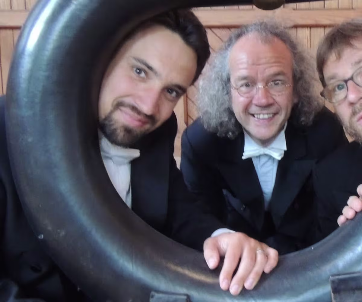 Informal Recital Series at The Early Music Store three men in tuxedos and the bell of a serpent instrument