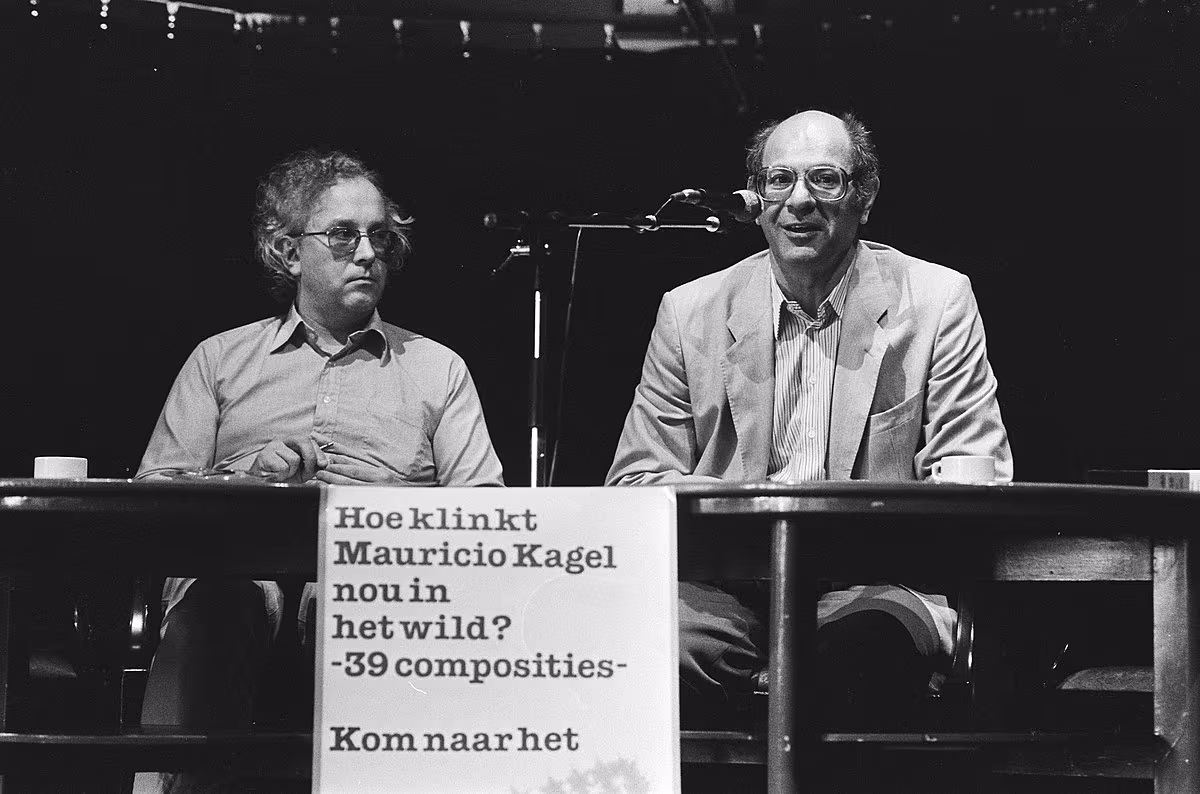 Frans de Ruiter (left) with Argentinian-Dutch composer Mauricio Hagel at a press conference during the 1985 edition of the Holland Festival (Photo by Vollebregt, Sjakkelien / Anefo; from the Dutch National Archives) Frans de Ruiter (left) with Argentinian-Dutch composer Mauricio Hagel at a press conference during the 1985 edition of the Holland Festival (Photo by Vollebregt, Sjakkelien / Anefo; from the Dutch National Archives)