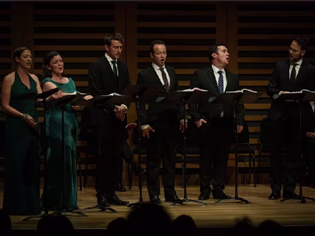 Monteverdi Vespers 1610 a capella group i fagiolini singing on a concert hall stage