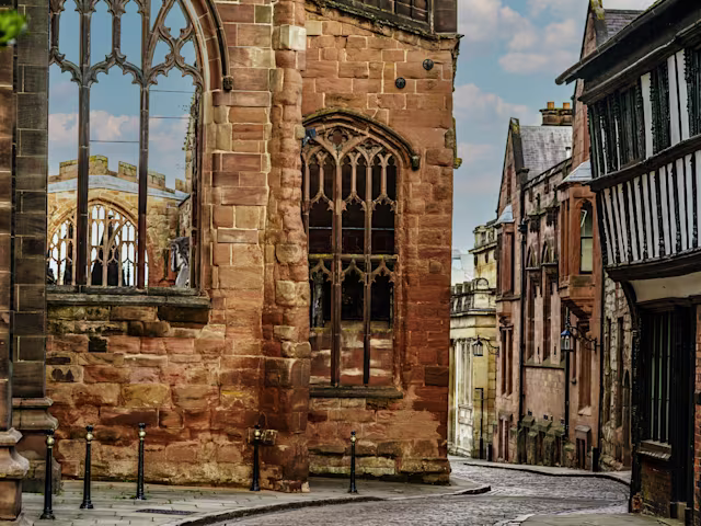 Echoes of Medieval Coventry a cobbled street twists past the ruins of coventry cathedral