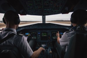 View from inside of the cockpit while a plan takes off