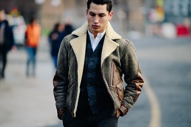 man on street in sheepskin jacket