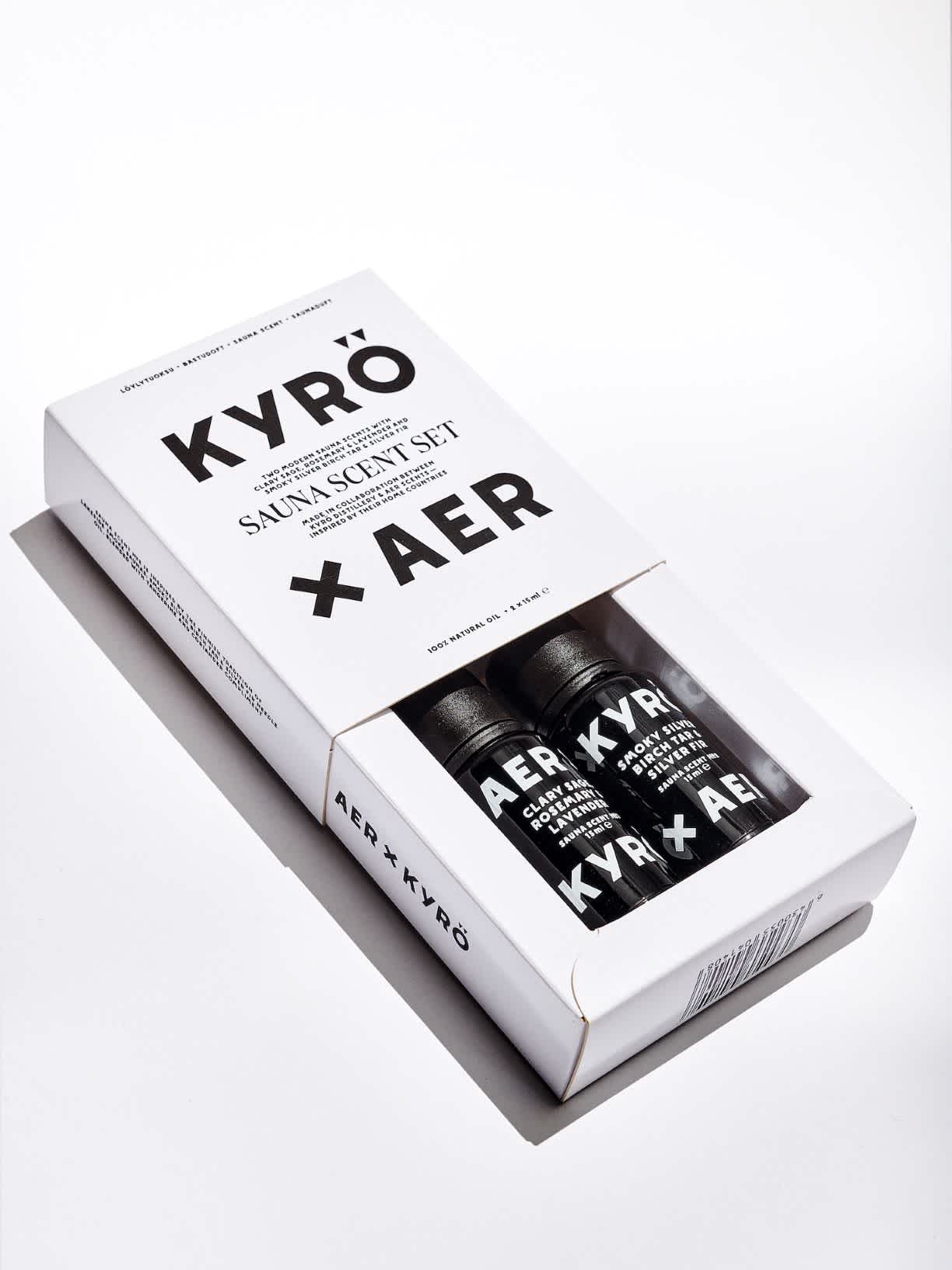 Product photo: two 15ml black opaque bottles branded with AER x KYRÖ, filled with sauna scents. 