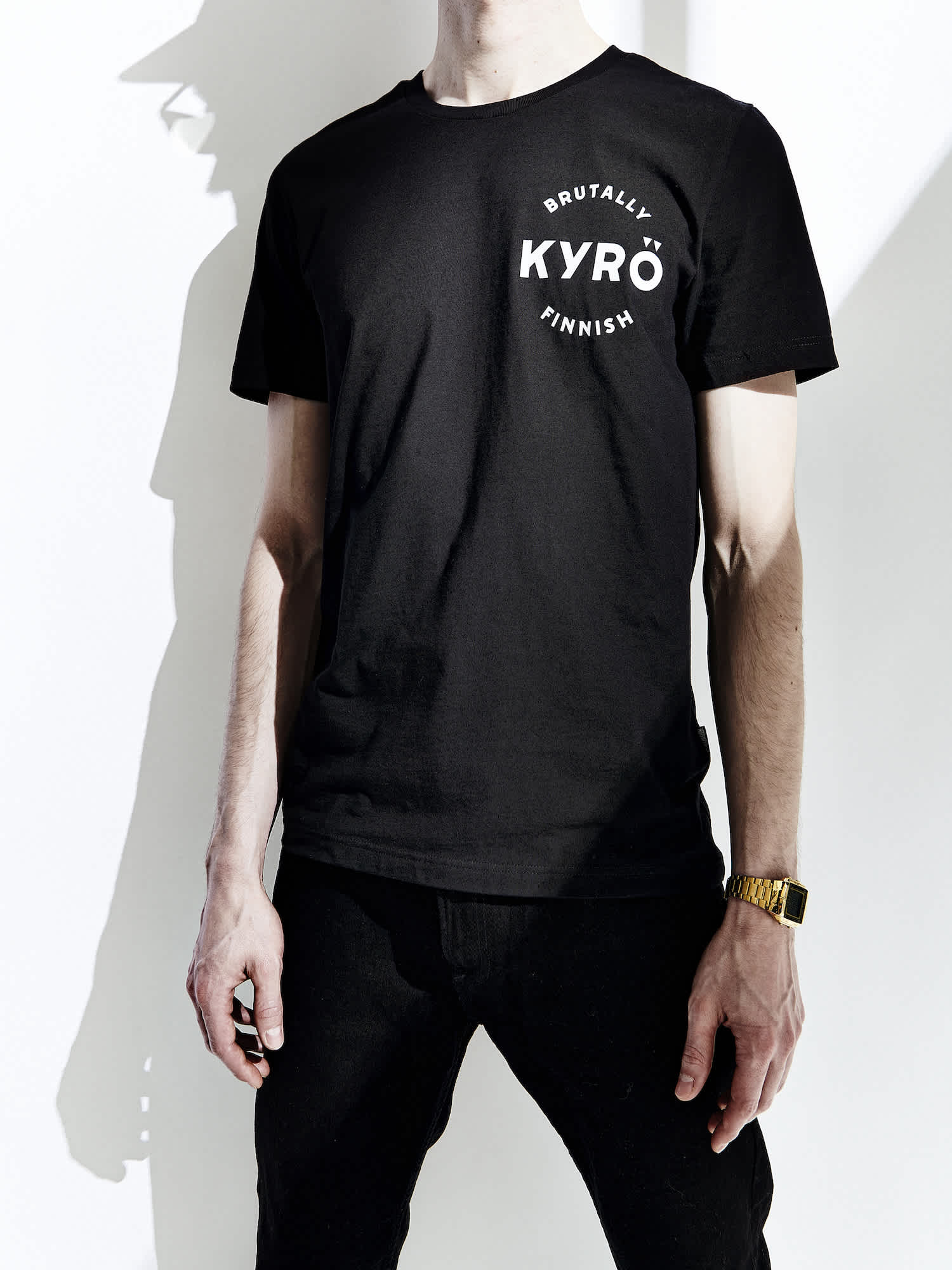 Product photo: black t-shirt with a white Kyrö logo on upper left chest. 
