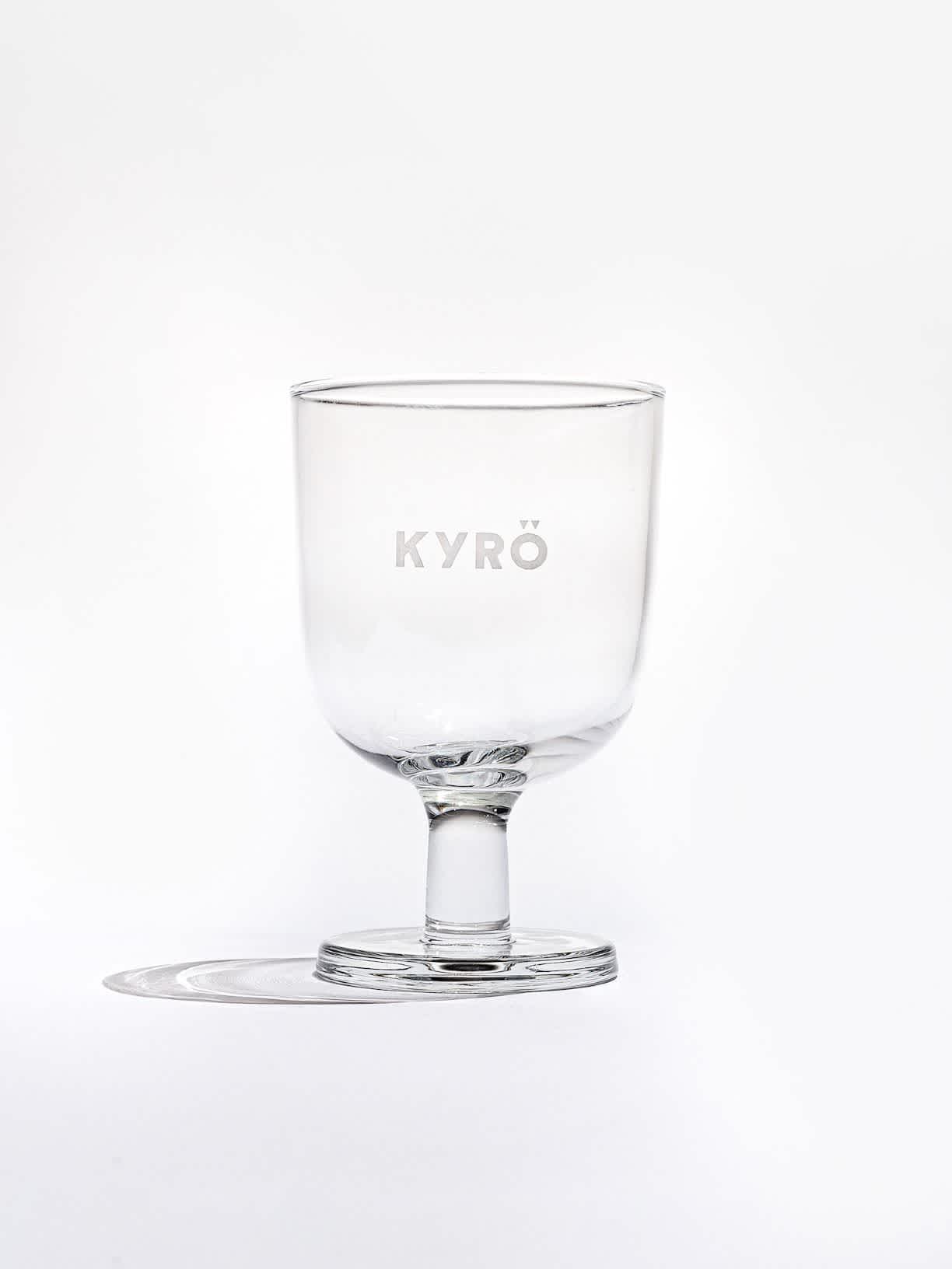 A clear, Kyrö branded cocktail glass. 