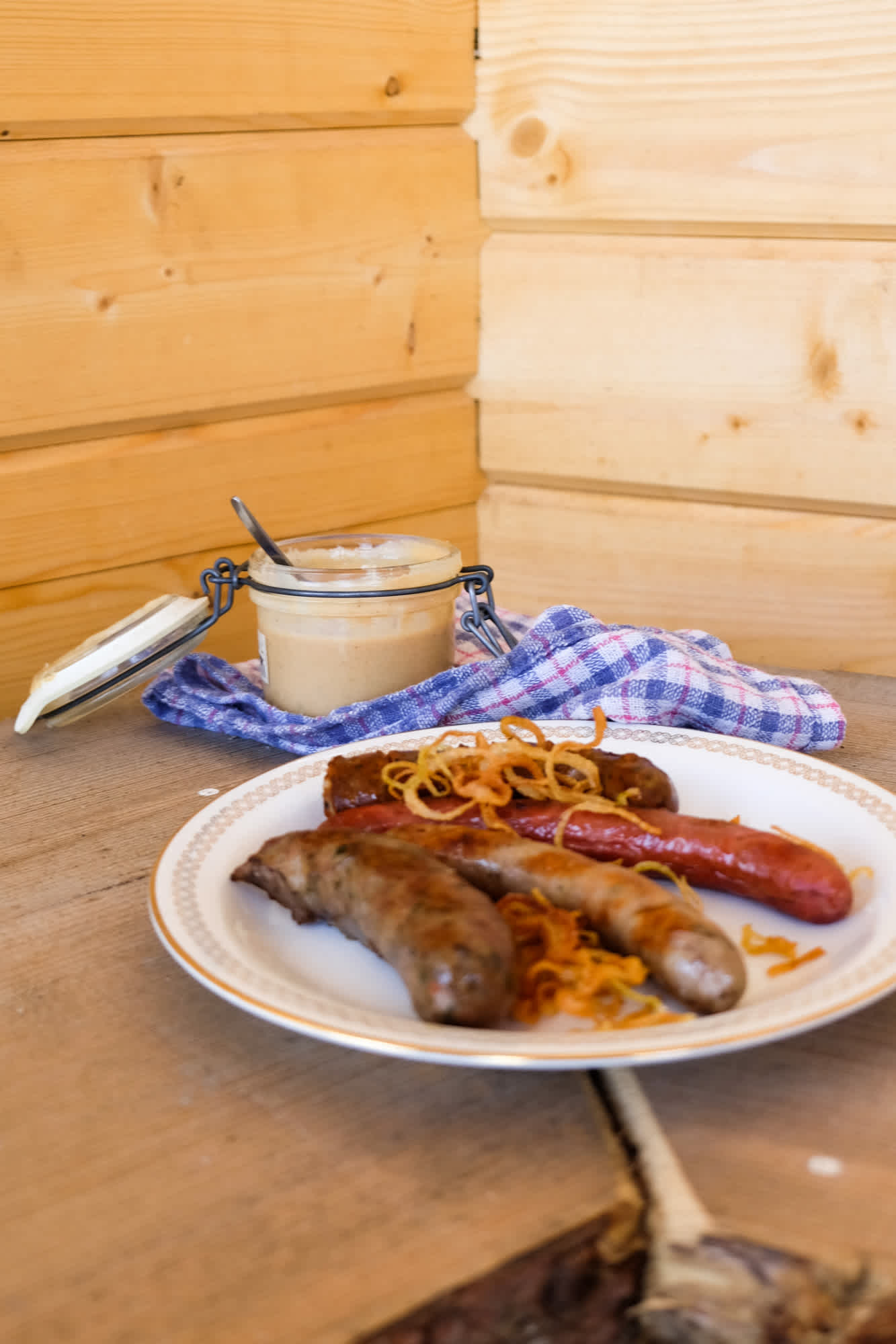 Sausages made on campfire and served with home made mustard.
