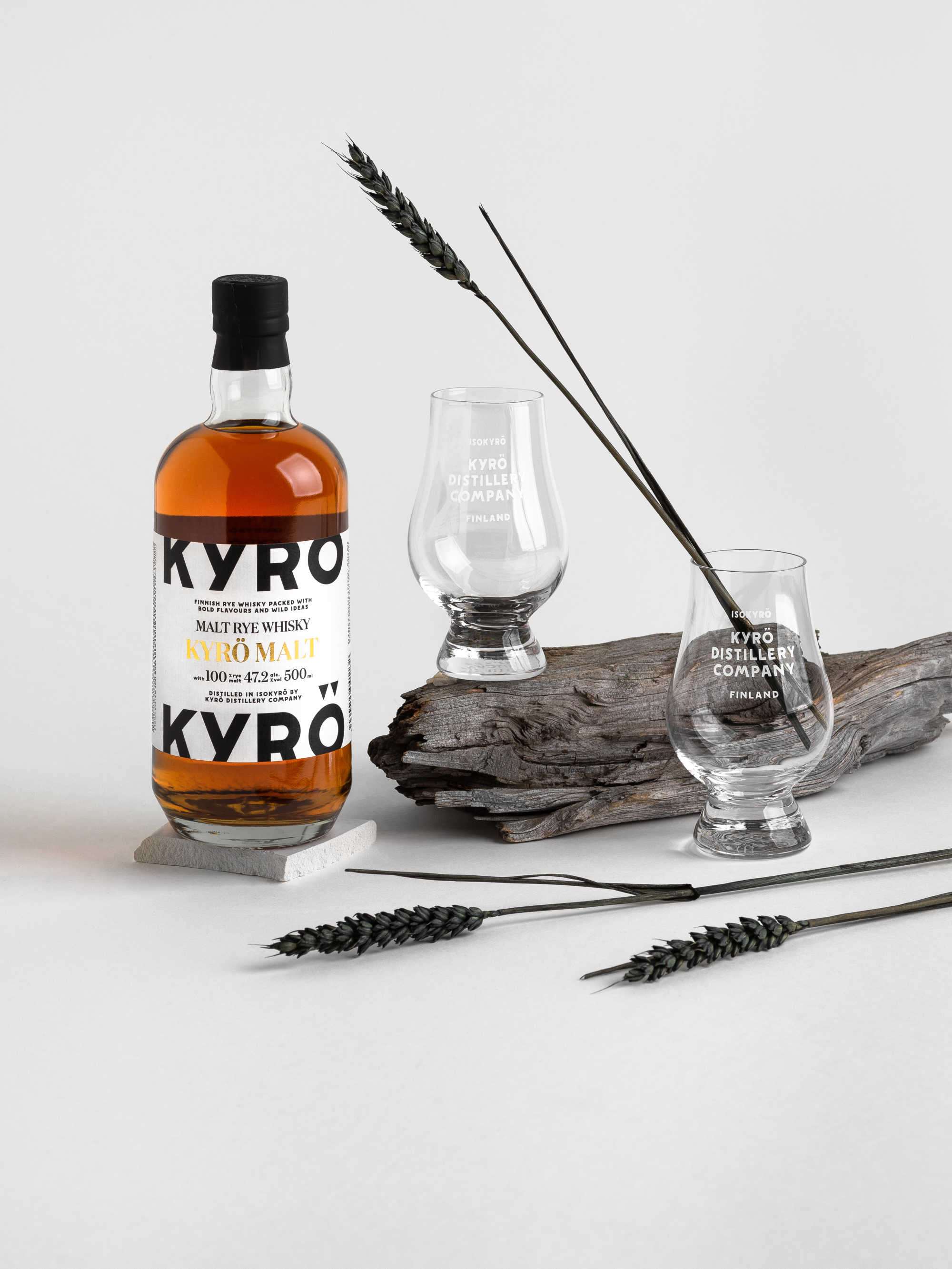 Product photo: 0,5 l bottle of award-winning, Finnish rye whisky from Kyrö Distillery Company and two tasting glasses. 
