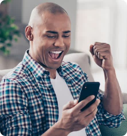 Gaming - man excited on phone