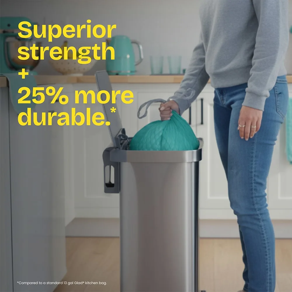 A person pulling a teal-color trash bag out of a trash can. The words "Superior strength + 25% more durable." in yellow