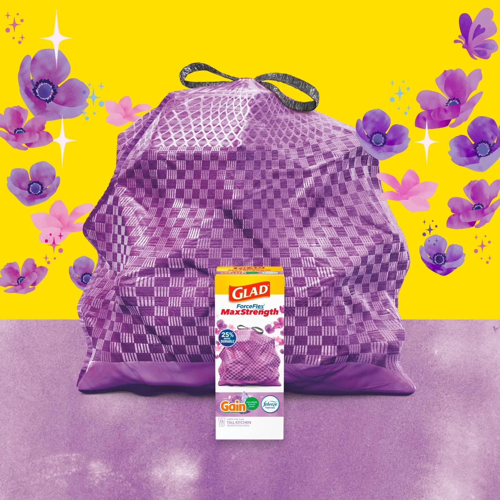 Purple trashbag with black handles on a background of yellow and purple with floral illustrations. A box of Glad trash bags sits in front.