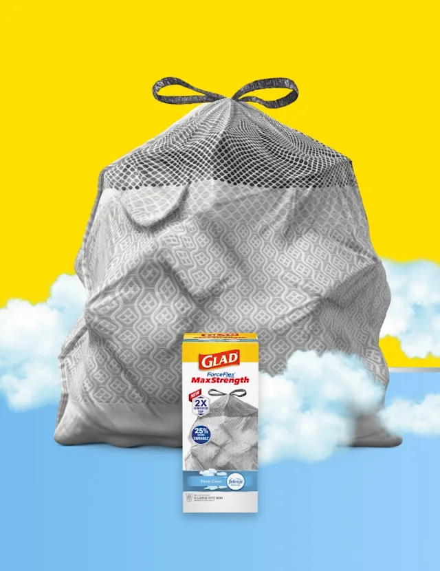 Large white mesh laundry bag with a drawstring closure, set against a bright yellow background with fluffy white clouds.
