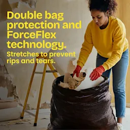 A woman in a yellow shirt stuffing trash in a large black trash bag. The words "Double bag protection and ForceFlex technology in yellow.