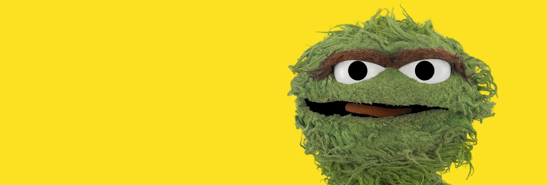 Oscar the Grouch on a yellow background