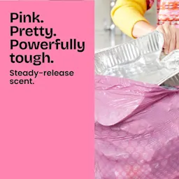 A person stuffing trash into a pink trash bag. Half of the panel is colored pink and has the words "Pink. Pretty. Powerfully tough."