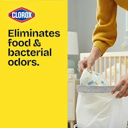 A person putting dirty diapers in a small trash bag. On the left is a yellow panel with a Clorox logo and the words "Eliminates food & bacterial odors."