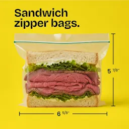 A roast beef sandwich in a 5-7/8" x 6-5/8" zipper bag on a yellow background. The words "Sandwich zipper bags." above.
