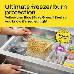 Person putting food in a bag in a freezer. The word "Ultimate freezer burn protection" in a yellow panel above.