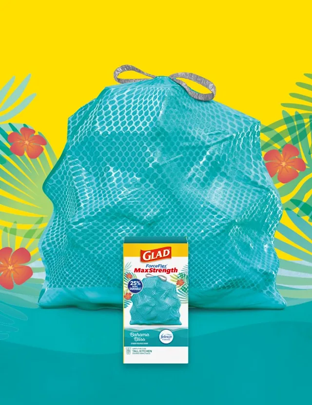 Teal colored trashbag with box of MaxStrength Bahama Bliss in front, yellow background with illustrations of tropical leaves and flowers.