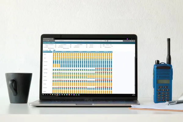 Enterprise Planning Schedule on a laptop with chart and white construction helmet