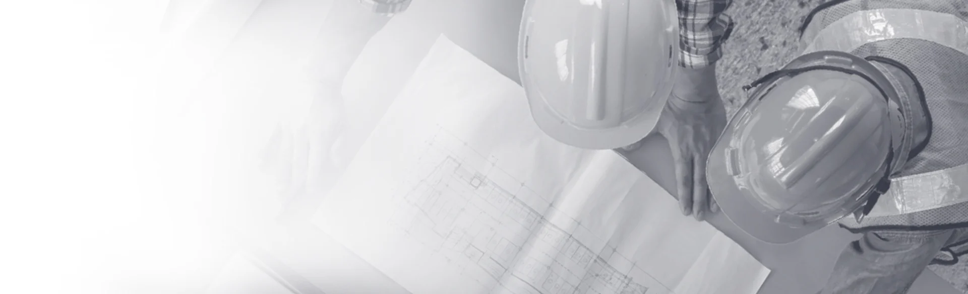 Over head shot of two construction workers looking at a drawing