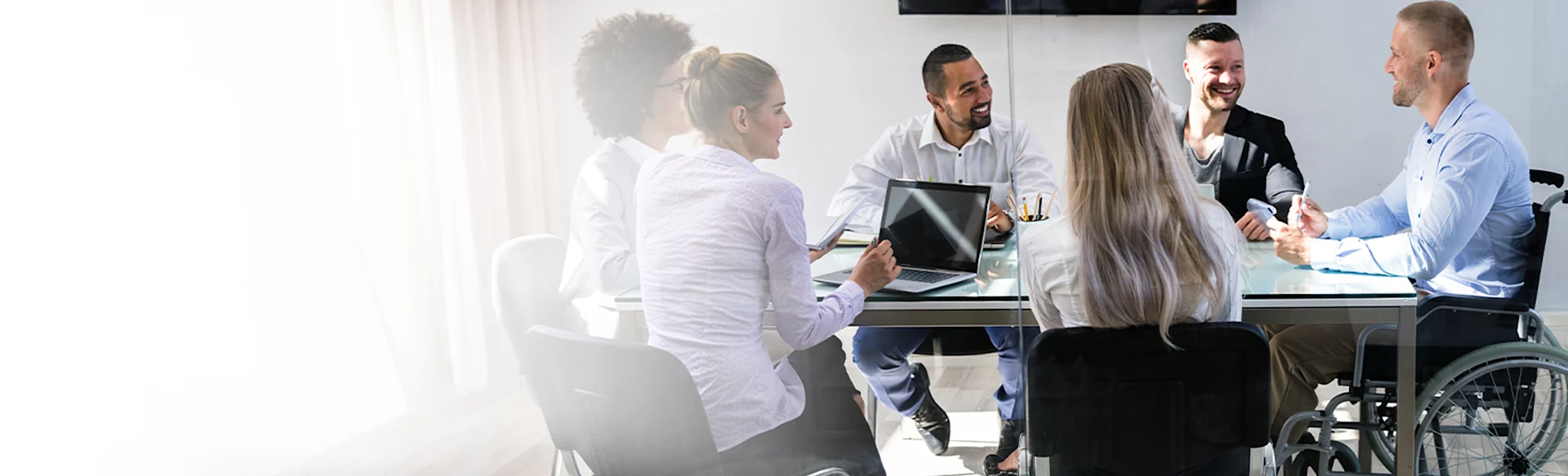 Employees talking at a table
