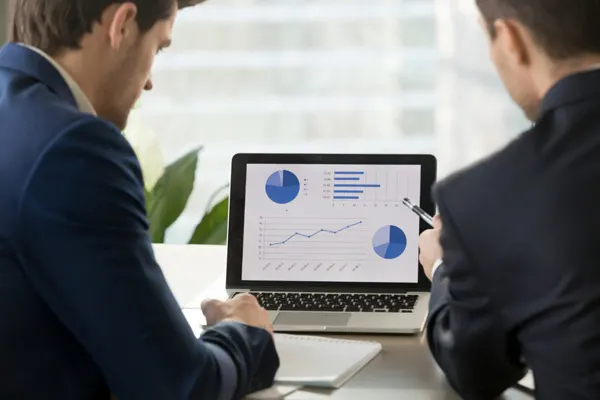 Accountants looking at financial charts THUMBNAIL