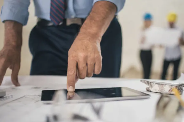 Male hand pointing on an iPad - THUMBNAIL