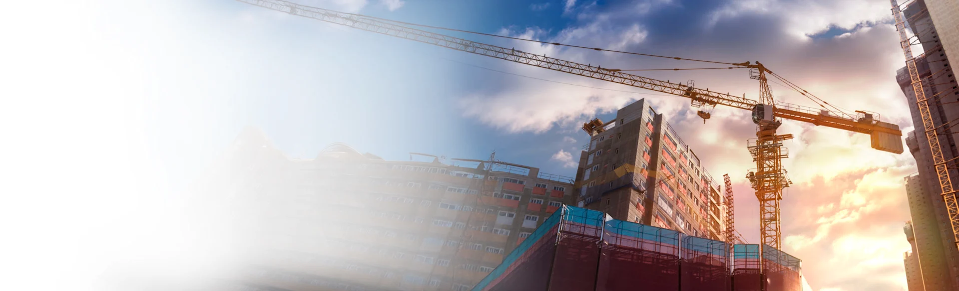Crane next to a building 1200x767