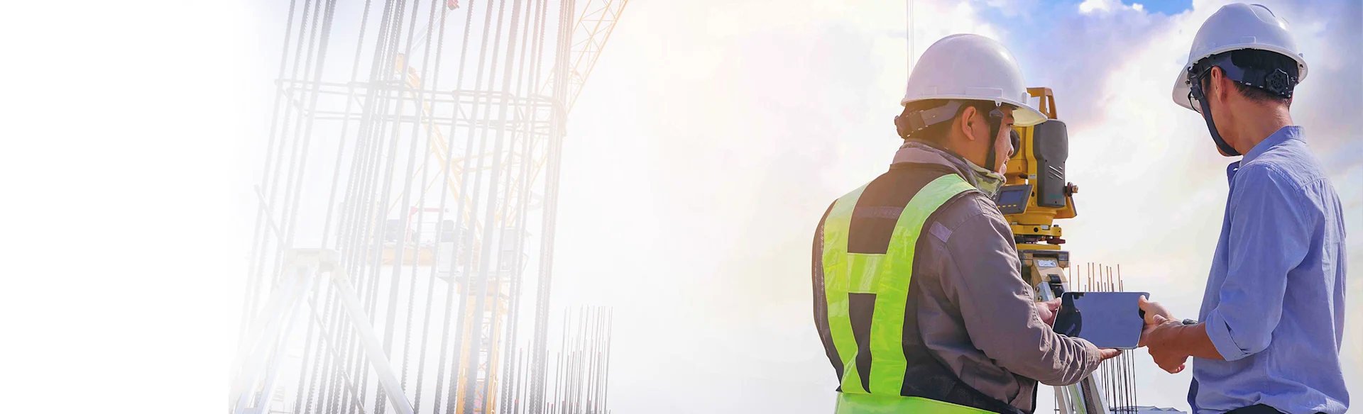 Two mechanical contractors on a bridge HEROImage