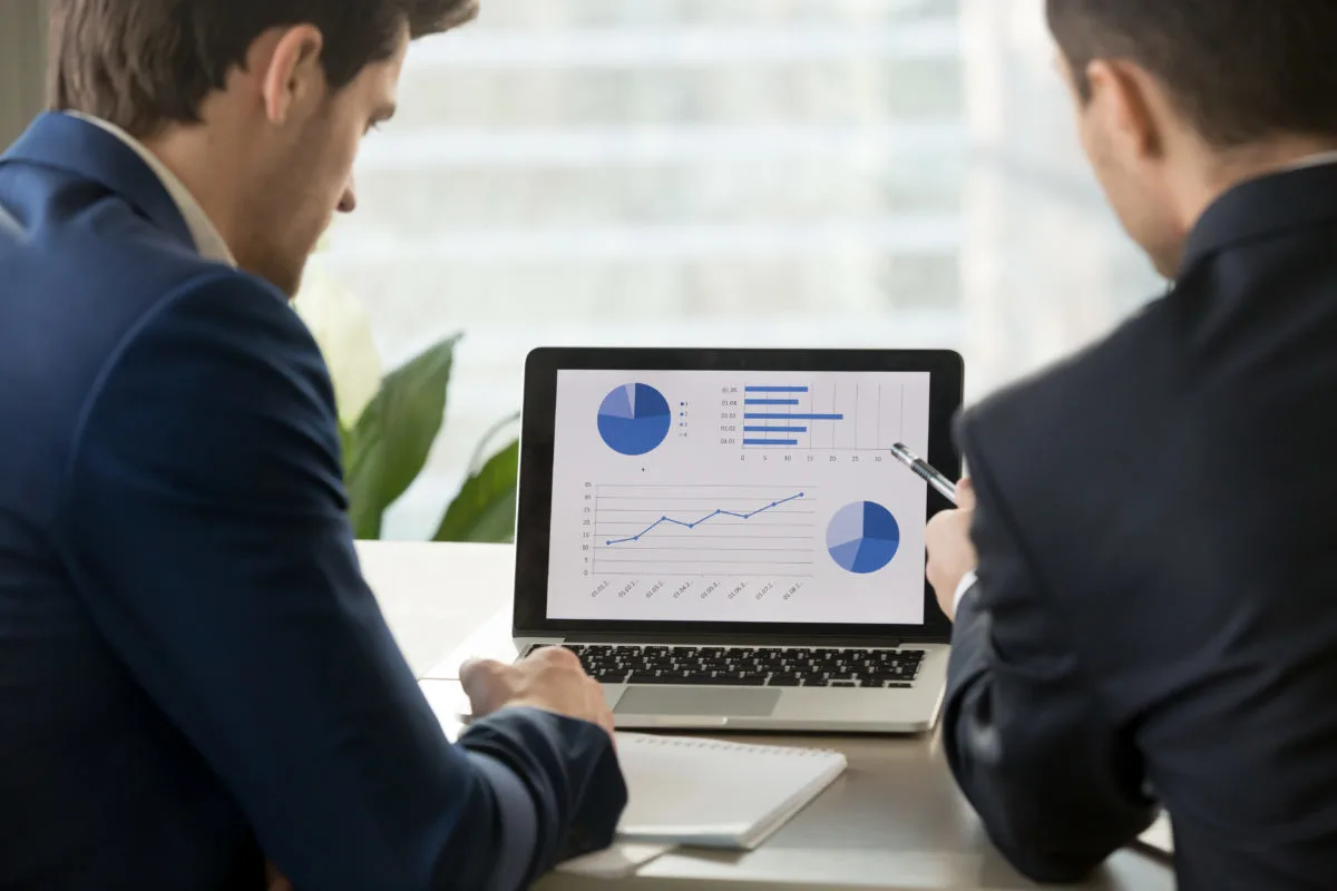 Accountants looking at finanical charts 1200x800