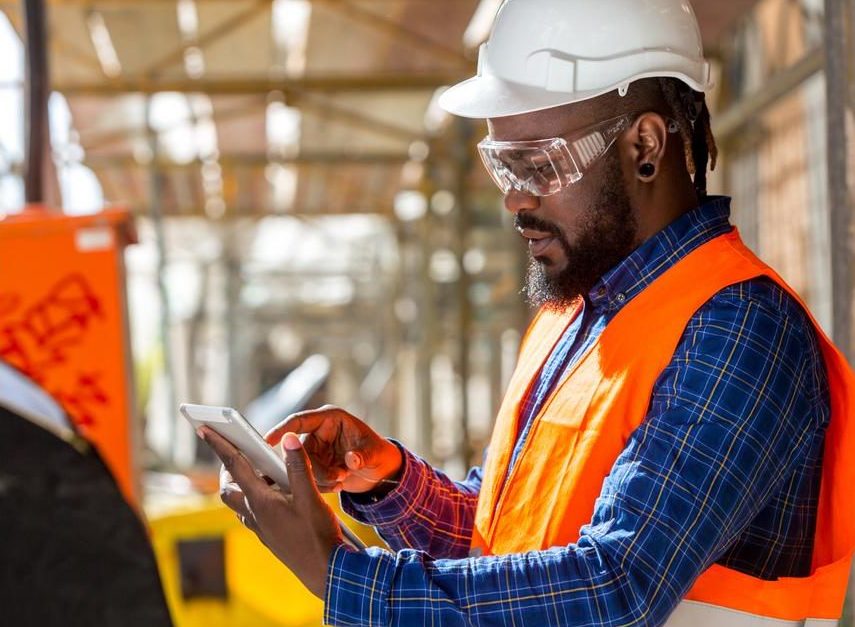 Construction worker looking at his iPad - THUMBNAIL 1000px