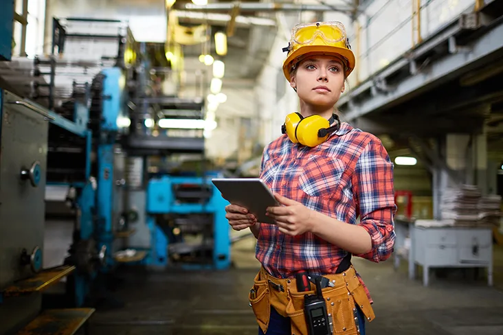 Female construction worker in a factory