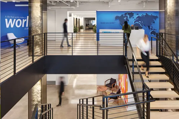 BIG Construction Hero 1200x675 - Office with employees walking around
