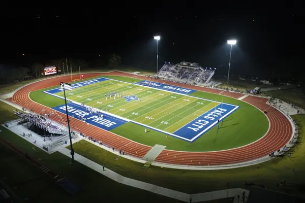 Football stadium falls city at night -  THUMBNAIL