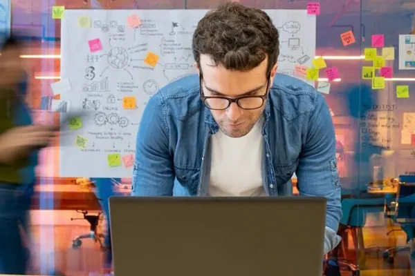 Male employee look at his monitor THUMBNAIL
