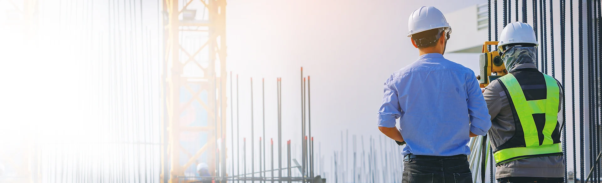 TwoMen-HardHats-Outdoors HEROImage