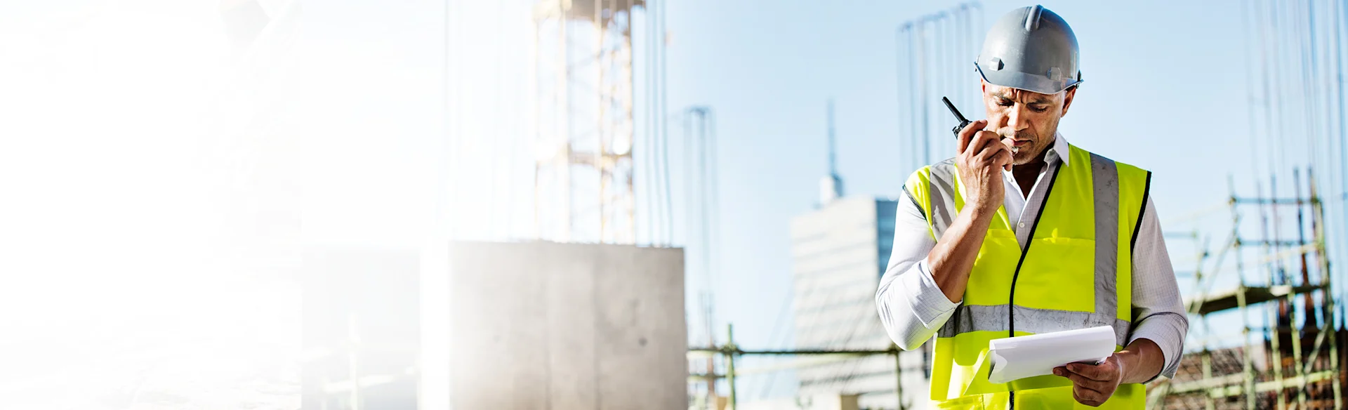 construction-worker-walkietalkie-hard-hat HEROImage