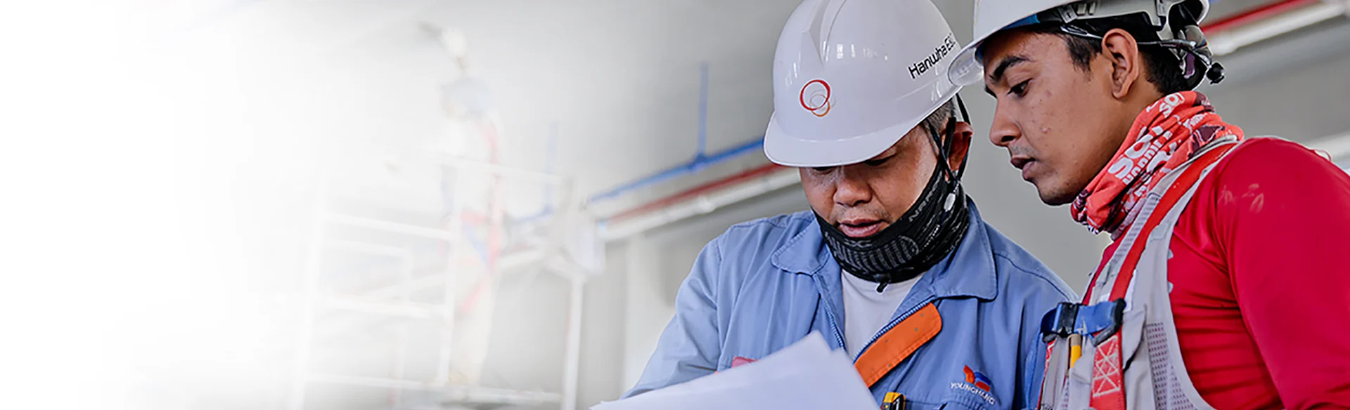 Construction workers looking at drawings with taping in the background Forecasting With Confidence