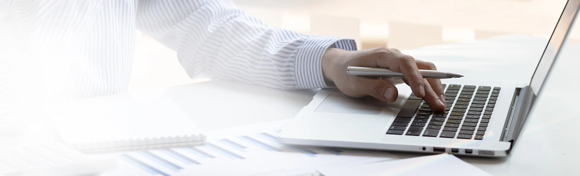 businessman-typing-working-laptop-finance HEROImage