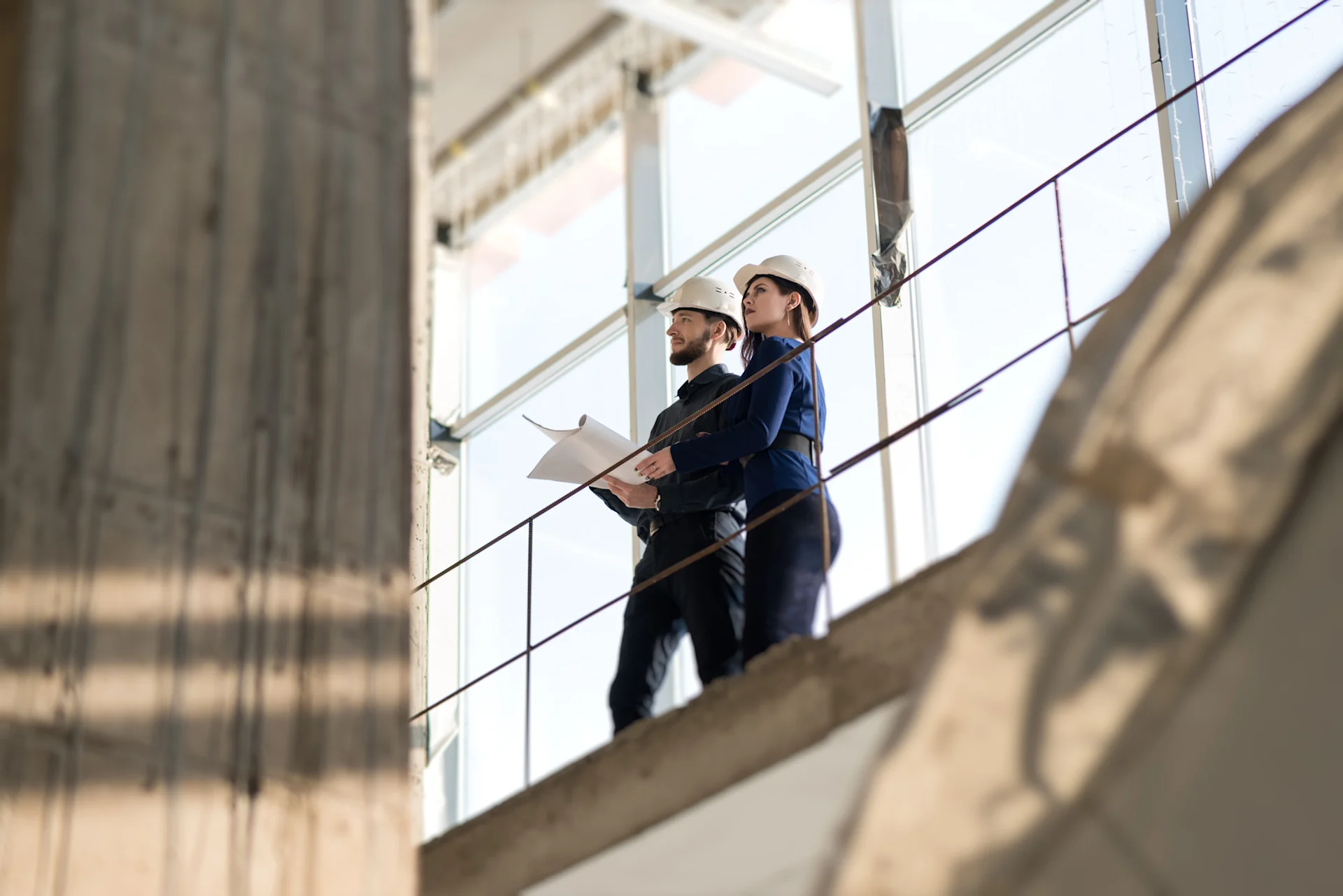 Construction executives looking at a wall