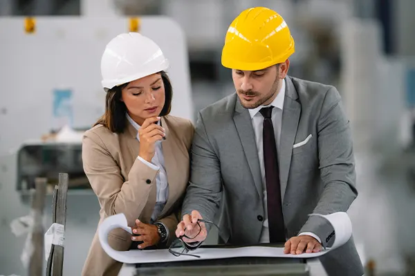Two executives looking at a document