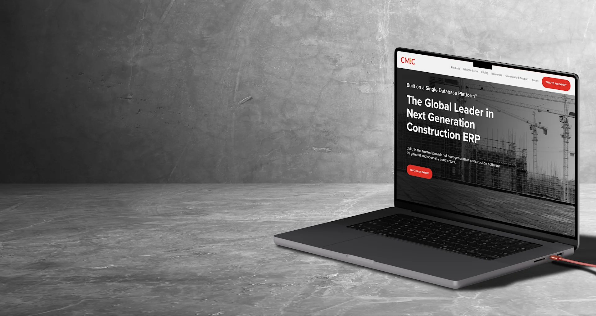 Laptop on grey concrete