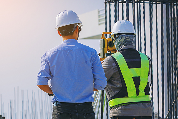 TwoMen-HardHats-Outdoors THUMBImage